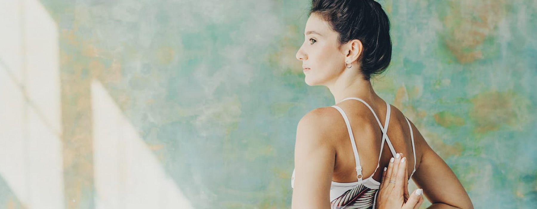 lifestyle image of a woman in a yoga pose
