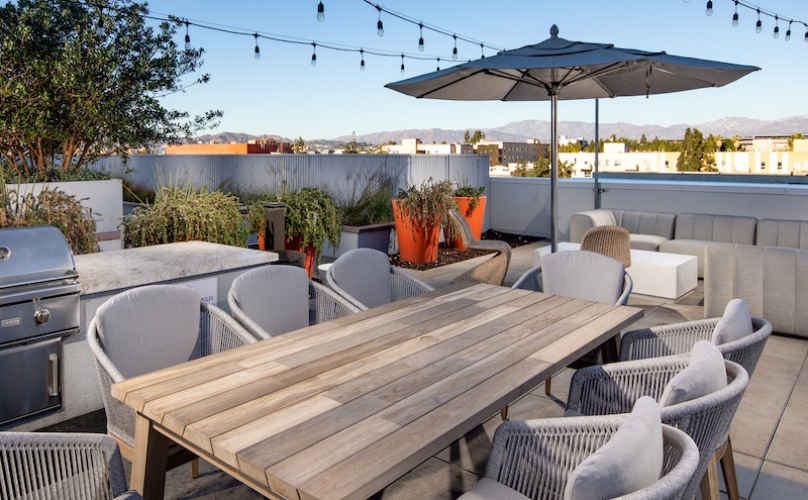 spacious lounge area with ample seating, easy access to other amenities and skyline city views