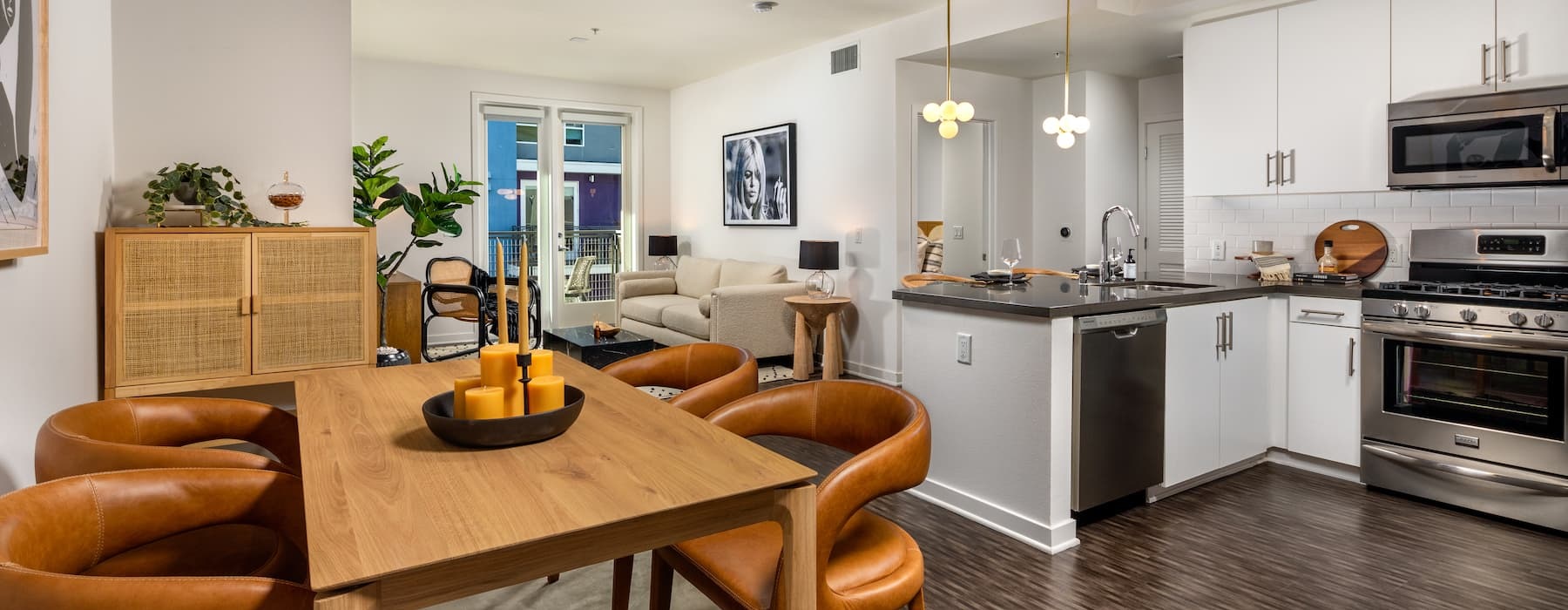 spacious kitchen with a long counter and on wood-style flooring