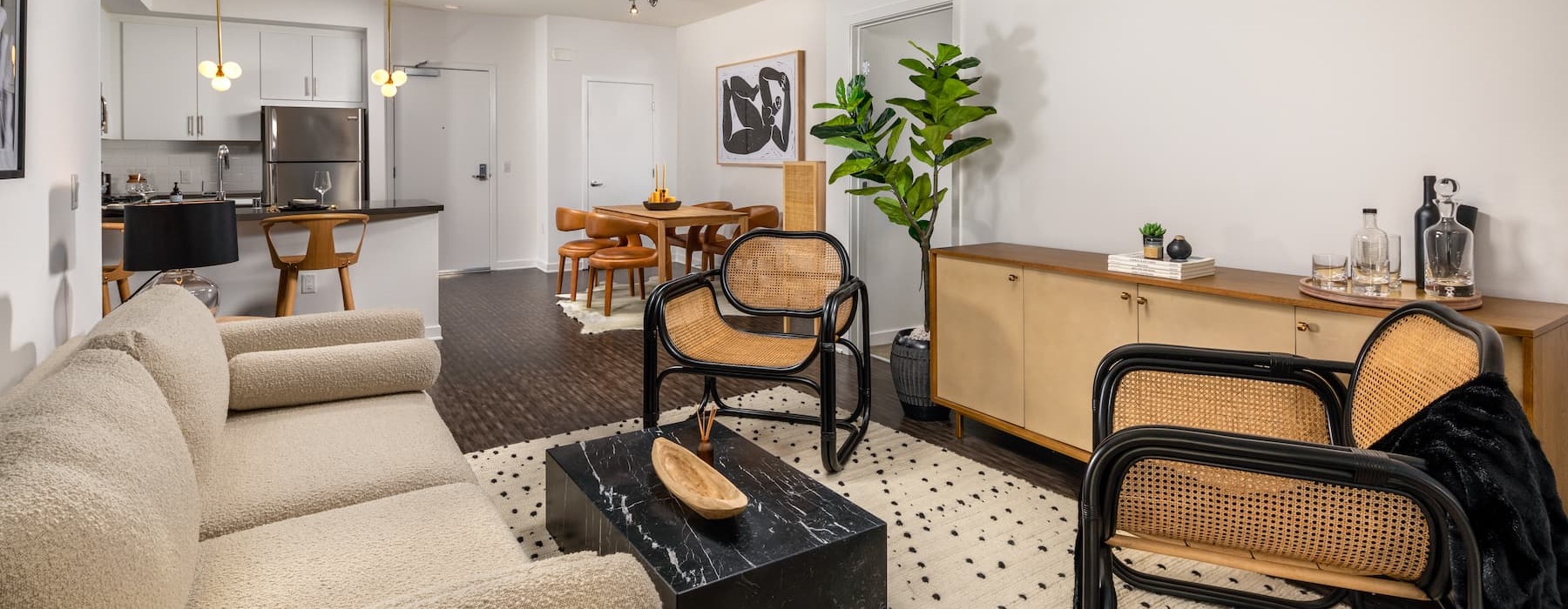 spacious living room with easy access to other rooms and on wood-style flooring