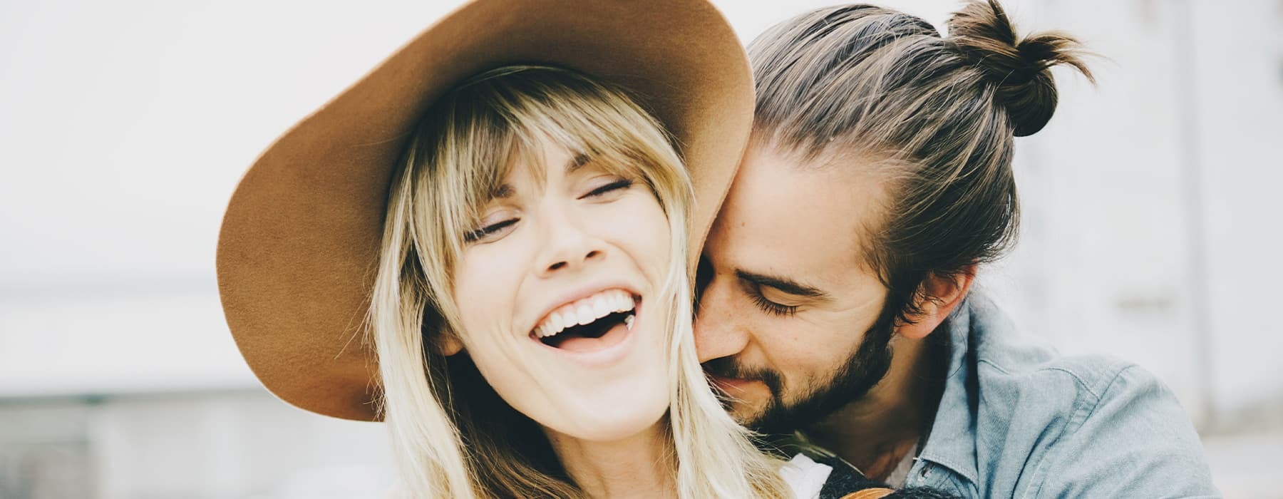 lifestyle image of a man and a woman embracing