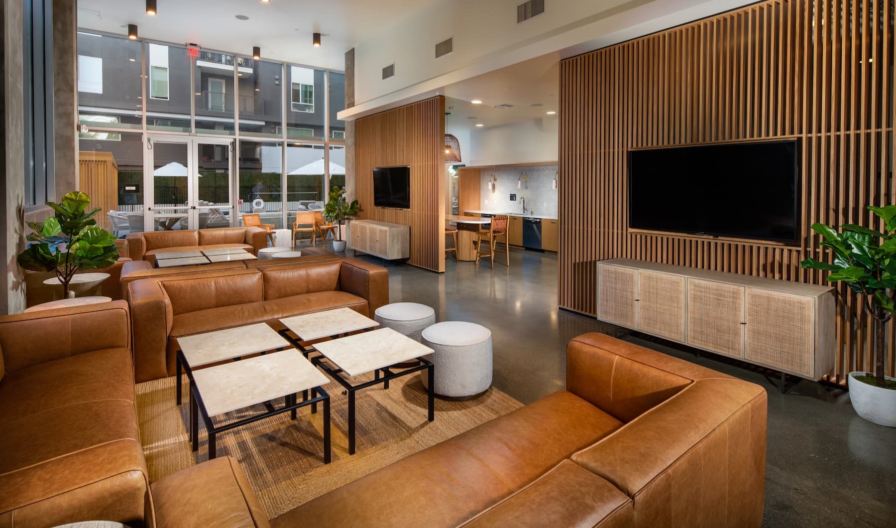 stylish lounge with leather seating, open spaces, boutique decor and ample room