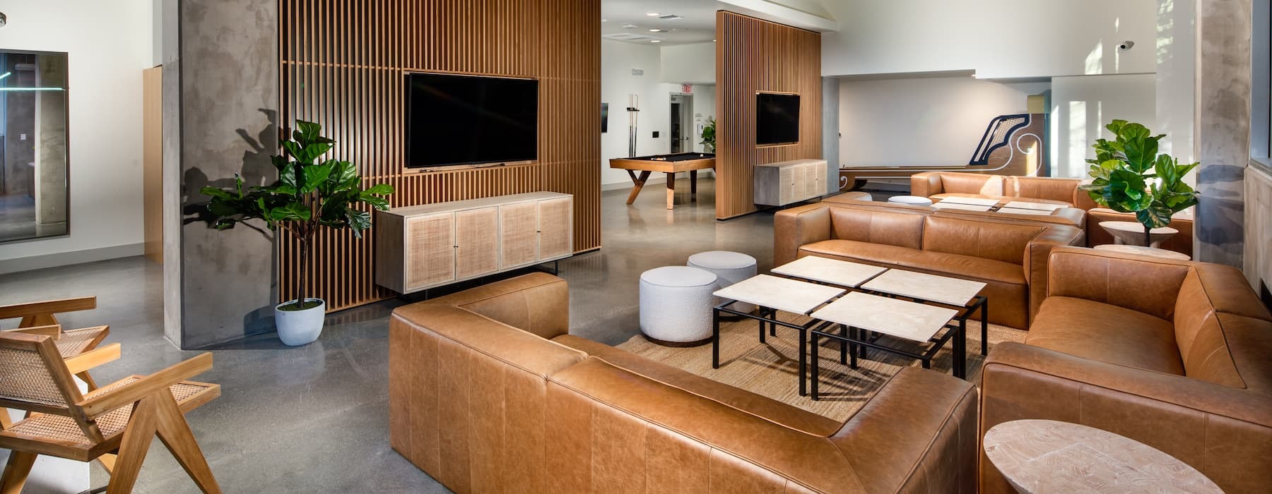 spacious clubroom with leather seating, fireplaces and large, open spaces